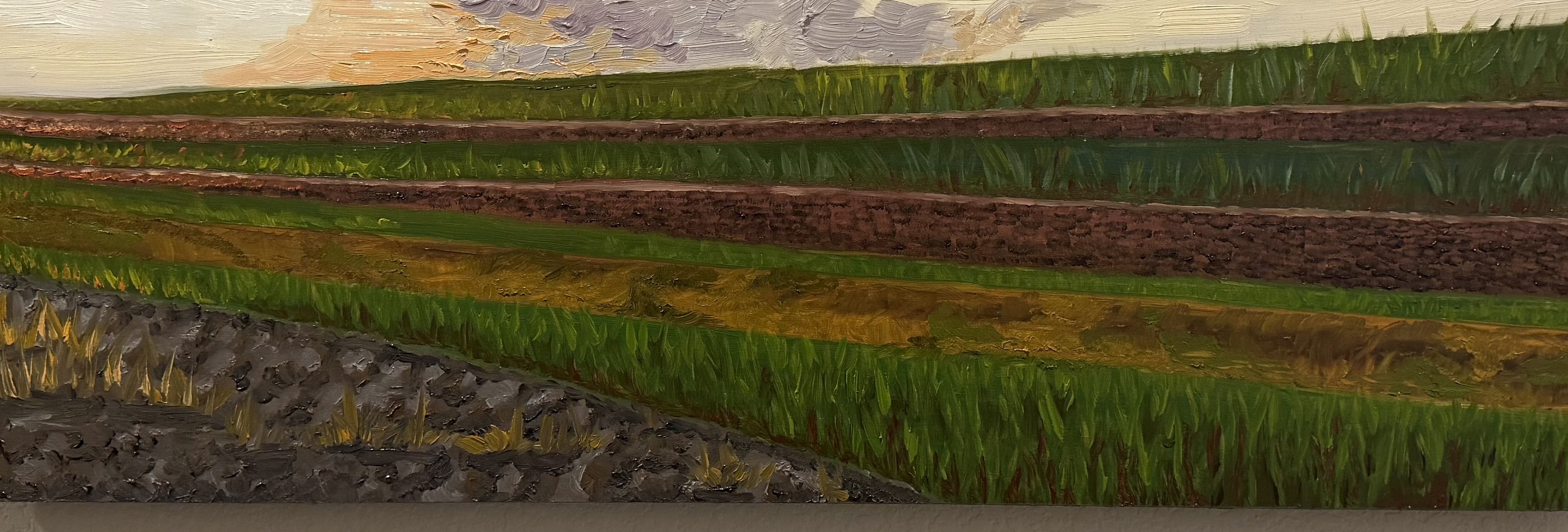 Oil painting of stratified agricultural fields at sunset — horizontal bands of tilled earth in gray and rust-brown, green crop rows, and a wide sky with billowing purple-gray clouds lit from below by a warm orange horizon.